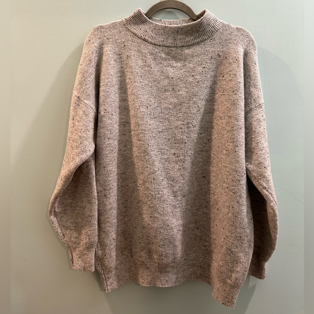 Super cozy funnel neck sweater really thick and warm! Heathered with some specks